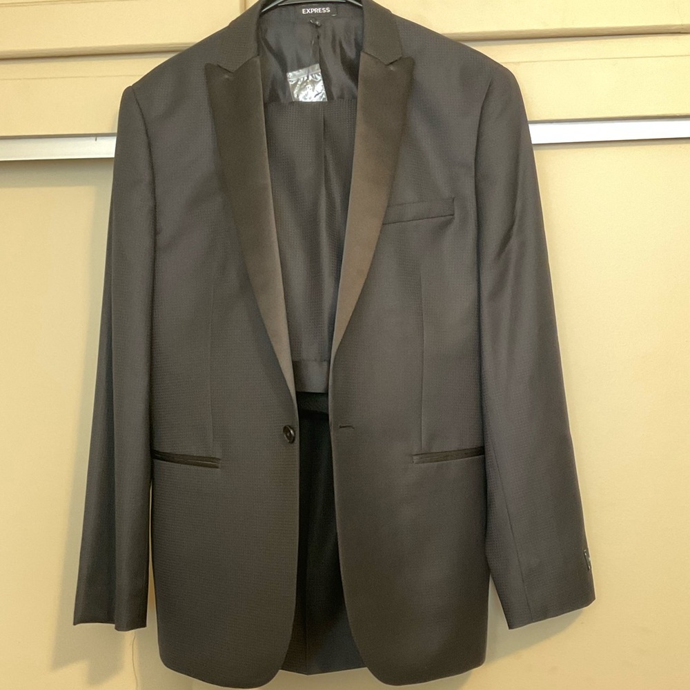 Brand new Express Black Tuxedo. Jacket is a 38R. The pants are 32 x 32.